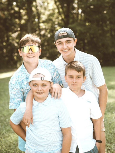 Dr. Andy Turner's four son's outdoors 